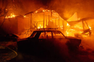 Fire Safety In The Home: Car and house in smoke and flame destroyed in fire accident at night